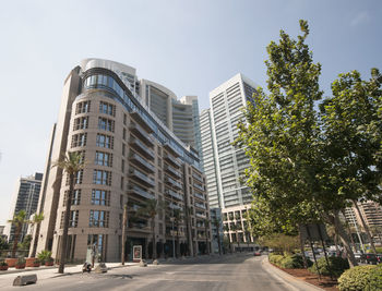 Low angle view of skyscrapers against clear sky