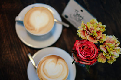 High angle view of cappuccino served on table