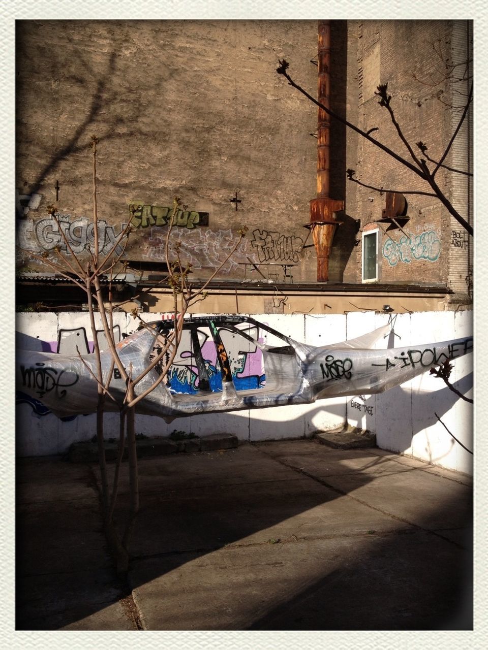 transfer print, auto post production filter, transportation, mode of transport, built structure, abandoned, obsolete, old, no people, architecture, day, wall - building feature, absence, damaged, hanging, indoors, fuel and power generation, power supply, empty, run-down