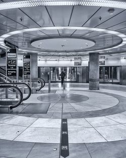 Man walking in illuminated subway station