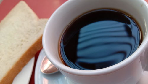 Close-up of coffee cup on table