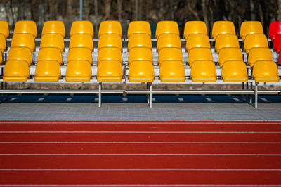 Grandstand stadium with yellow seats outdoors front view