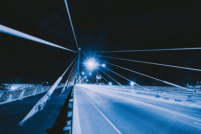 Light trails on road in city at night