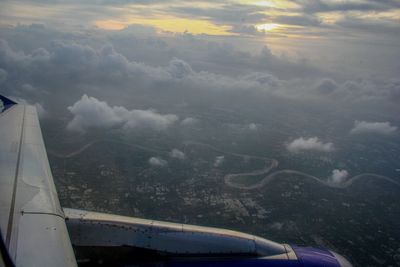 Cropped image of airplane flying over landscape