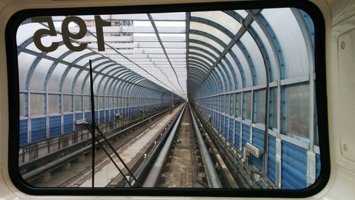 Railroad track seen through train windshield
