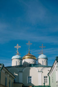 Low angle view of buildings against blue sky