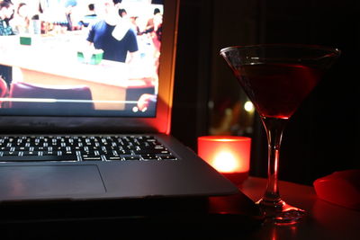 Close-up of wine glasses on table