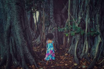 Rear view of girl in forest