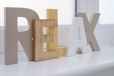 Relax text made with toy blocks on window sill