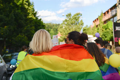 Rear view of people against sky