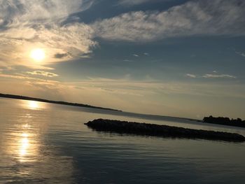 Scenic view of sea against sky at sunset