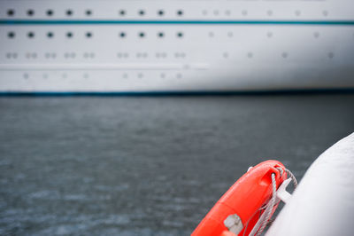 Close-up of red boat on sea