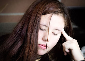 Close-up of thoughtful young woman