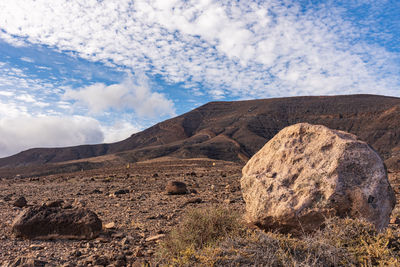 Rock formations on landscape against sky