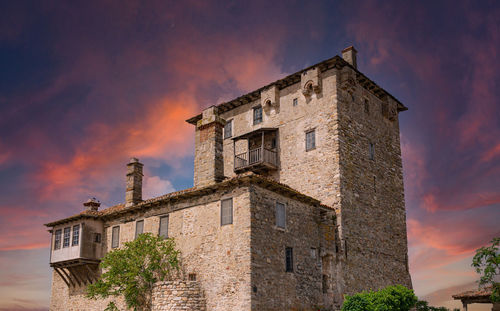 Low angle view of old building against sky