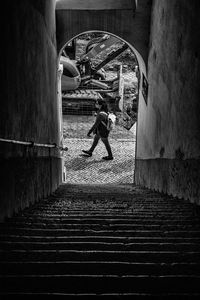 Man walking in tunnel