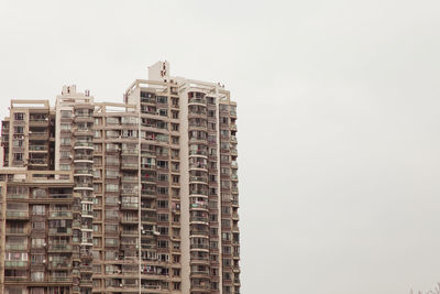 Low angle view of buildings against clear sky