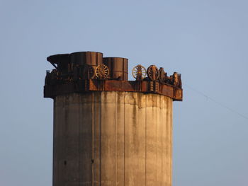 Low angle view of built structure against clear blue sky