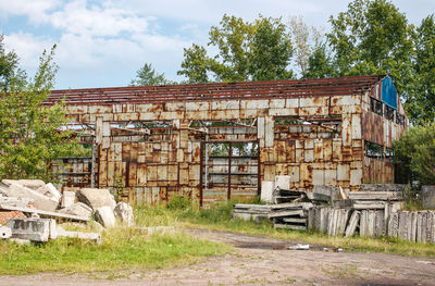 Old abandoned building against sky