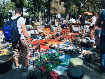 People for sale at market stall