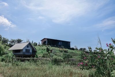 House on field against sky