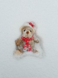 Close-up of stuffed toy on snow