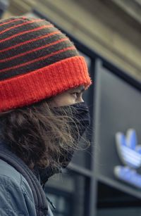 Close-up portrait of woman wearing hat