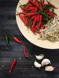 High angle view of red chili peppers on table