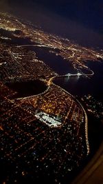 Aerial view of illuminated cityscape at night