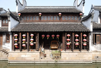 Illuminated lanterns in building by city