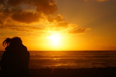 Scenic view of sea at sunset