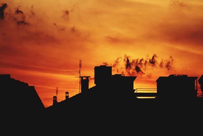 Silhouette buildings at sunset