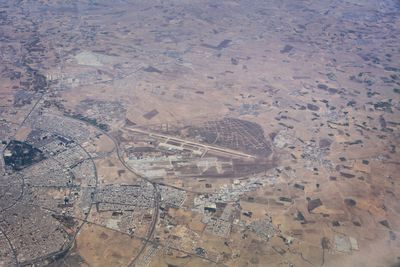 High angle view of airplane flying over land