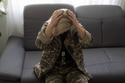 Low section of woman sitting in tent