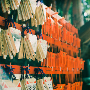 Close-up of wooden objects hanging at market stall