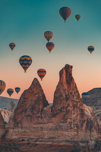 Low angle view of hot air balloons flying in sky