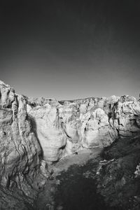 Scenic view of rocks against clear sky