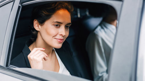 Portrait of woman in car