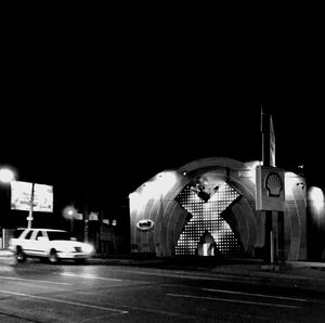 Illuminated lamp post at night