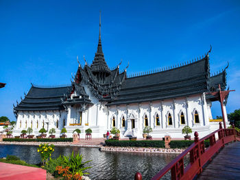 Temple building against blue sky