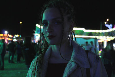 Close-up portrait of young woman in city