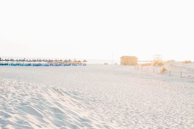 Scenic view of beach against clear sky