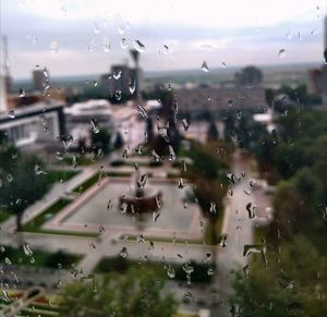 Close-up of wet glass window in rainy season