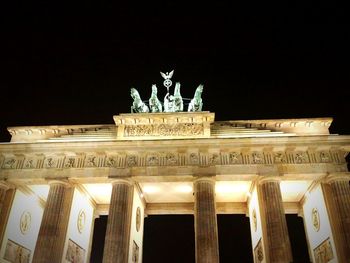 Low angle view of statue at night