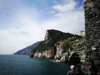 Scenic view of sea against cloudy sky