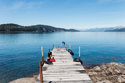 Pier over lake against sky