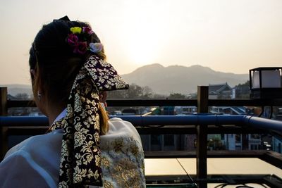 Rear view of woman in traditional korean clothing