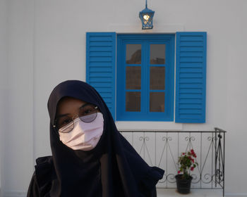 Portrait of young woman wearing mask