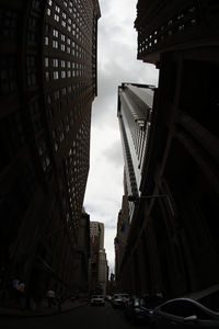 Low angle view of modern buildings in city against sky