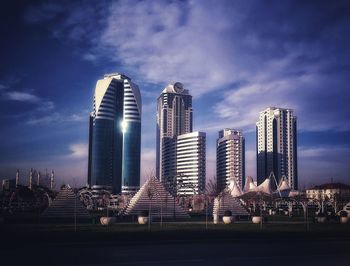 Modern buildings against sky in city